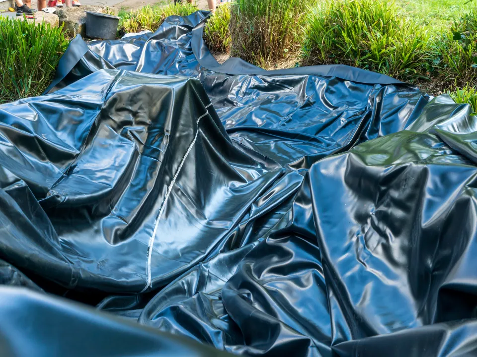 Pond liner laid down - Grass Roots Pond And Garden Pond liner laid down