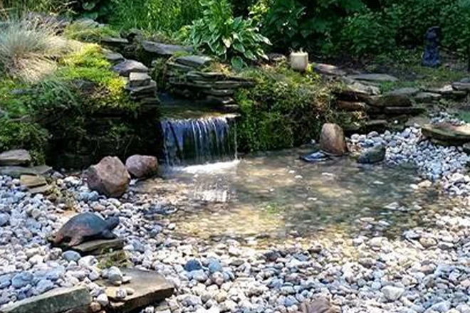 Pondless waterfall with gravel basin - Grass Roots Pond And Garden Pondless waterfall with gravel basin