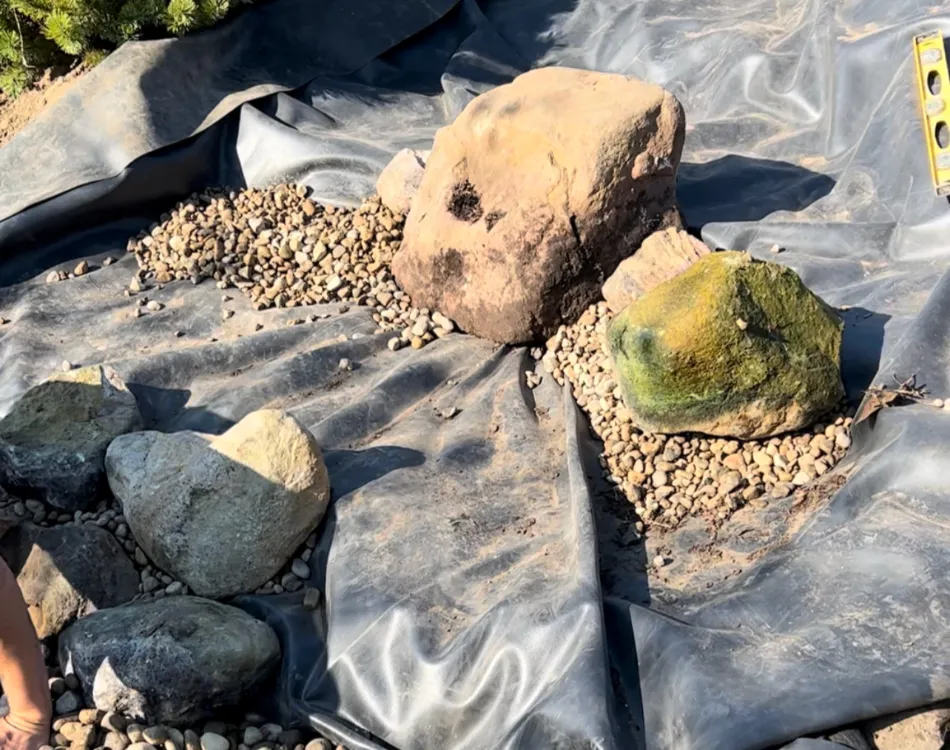 Starting to rock out the waterfall - Grass Roots Pond And Garden Starting to rock out the waterfall